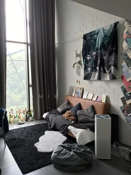 Living features: large floor-to-ceiling windows, grey curtains, white painted walls, black area rug, brown leather sofa, decorative wall art, bean bag chair, small white air purifier, various framed photographs, bottles on window ledge; style: modern; view: greenery.