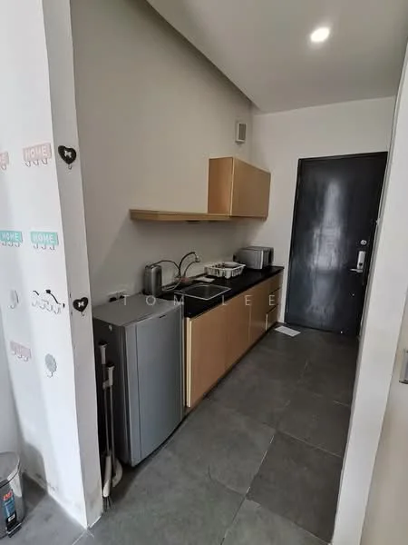 Kitchen features: single-bowl stainless-steel sink, chrome pull-down faucet, black countertop, wood cabinetry with flat-panel design, built-in microwave, stainless-steel fridge, grey tile flooring, wall-mounted shelf, recessed downlights, black door, white walls with decorative stickers; style: modern.