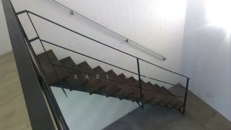 Room features: metal railing, concrete staircase, white painted walls, natural light from windows, wooden flooring at the base; style: modern.
