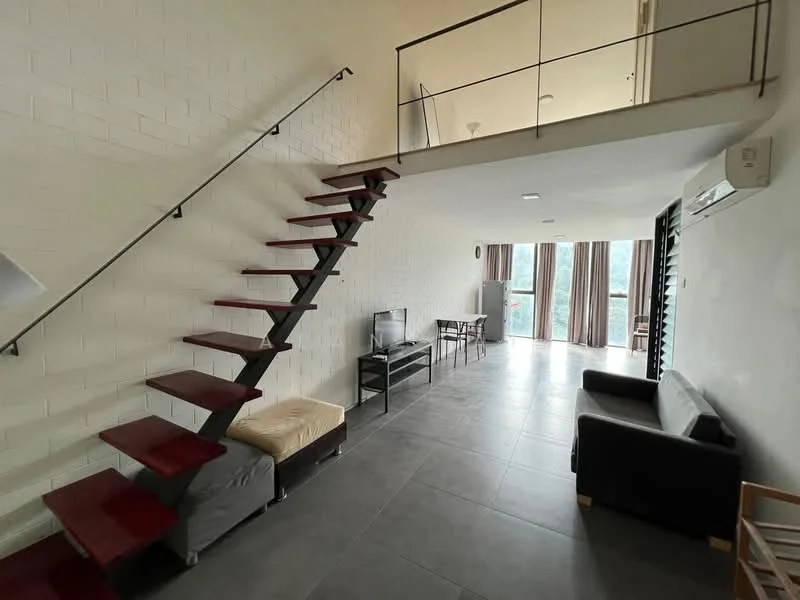Living features: grey tiled flooring, white painted walls, exposed brick wall, sofa in black, coffee table, TV console, wall-mounted TV, 1 wall-mounted split AC, large windows with sheer curtains, staircase with wooden treads and metal railing, dining table with chairs, open layout to upper level; style: modern; view: garden.