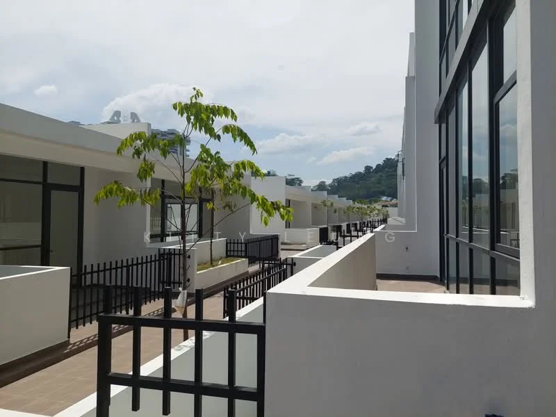 Exterior type: linked terrace house; features: white painted facade, flat roof, manicured walkway, fenced balcony, landscaped area with small tree, large windows, surrounded by greenery, two-storey structure; style: modern.
