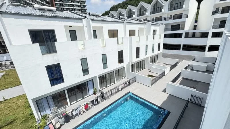 Exterior type: linked terrace house; features: white painted facade, flat roof, approximately 3-storey, infinity pool, pool deck with loungers, manicured lawn, surrounded by greenery, balconies on upper levels, glass windows, fenced perimeter; style: modern.