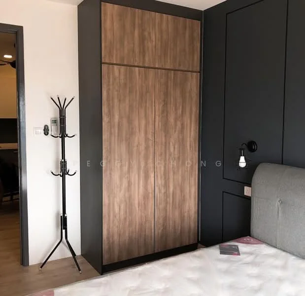 Bedroom features: wooden wardrobe with sliding doors, grey upholstered bed, black accent wall, light wood flooring, wall-mounted bedside lamp, coat rack, decorative wall paneling, neutral bedding; style: modern.