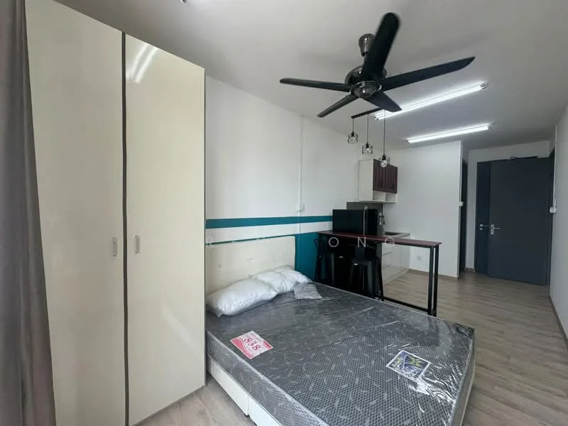 Bedroom features: queen-size bed, white bedding, ceiling fan with light, wooden flooring, built-in wardrobe with sliding doors, kitchenette with black countertop, stainless-steel fridge, 2-seater dining table, pendant lighting above dining table, grey accent wall, window with curtain, open space layout; style: modern.