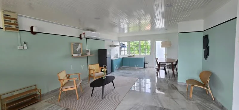 Living features: marble flooring, white painted walls, crown moulding, ceiling with paneling, floor-to-ceiling windows, air conditioning unit, round coffee table, 2 wooden chairs, dining table with 4 chairs, kitchen cabinetry in blue, light fixture, decorative wall art; style: modern; view: garden.