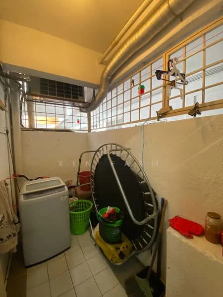 Laundry features: front-load washing machine, trampoline, green laundry basket, red cleaning supplies, exposed ductwork, window with metal grilles, white tiled flooring, wall-mounted air conditioning unit.