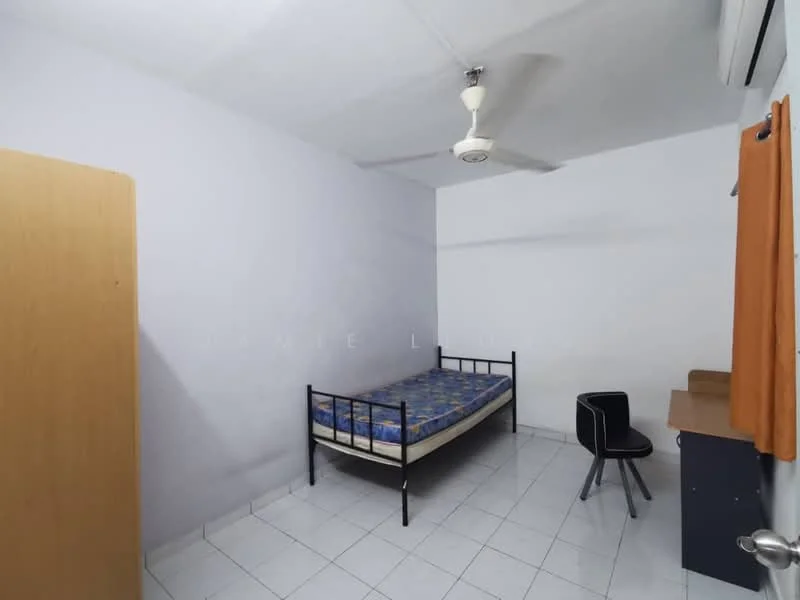 Bedroom features: single bed, blue patterned bedspread, white painted walls, white tiled flooring, ceiling fan, study desk, black chair, wooden wardrobe, orange curtain, air conditioning unit.