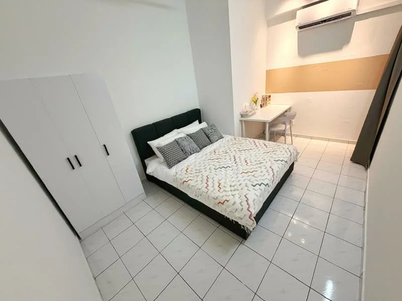Bedroom features: queen-size bed with patterned bedding, white ceramic tile flooring, white painted walls, built-in wardrobe with two doors, study desk with chair, wall-mounted air conditioning unit, decorative wall with wood paneling, window with curtain; style: modern.