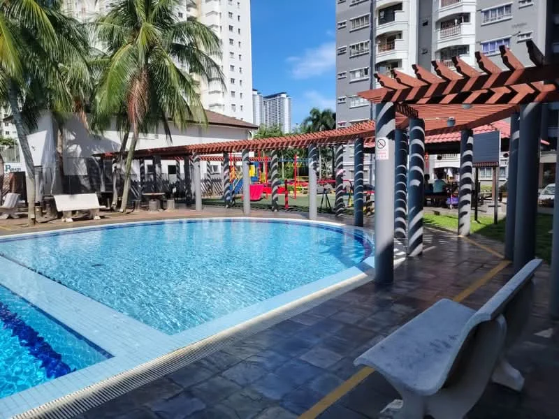 Exterior type: swimming pool deck; features: rectangular swimming pool, poolside loungers, palm trees, pergola with wooden beams, children's playground in background, manicured lawn, tile flooring around pool, sunny blue sky, surrounding residential buildings; style: modern.