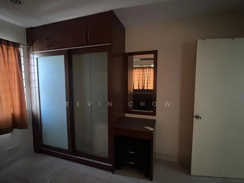 Bedroom features: built-in wardrobe with sliding doors, wooden cabinetry, mirror on wardrobe, small desk or vanity, tile flooring, orange curtains, neutral wall color, single door, ceiling light fixture.