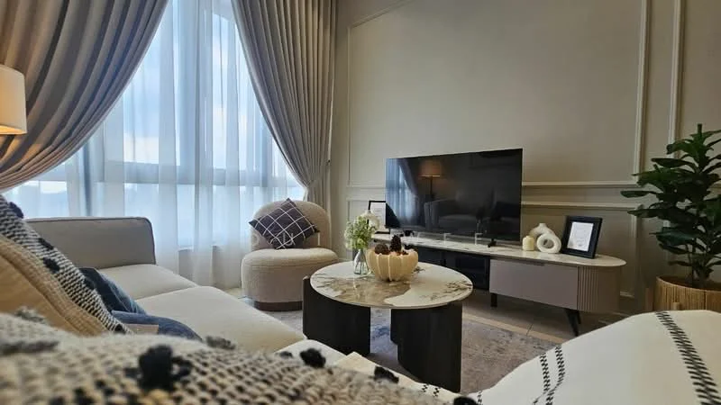 Living features: 3-seater fabric sofa in light grey, accent chair in cream, coffee table with marble top, TV console in light wood, wall-mounted flat-screen TV, floor-to-ceiling windows with sheer curtains, decorative throw pillows, houseplant in ceramic pot, area rug with geometric pattern, decorative bowl on coffee table, framed artwork on wall, crown moulding on walls; style: modern; view: city.