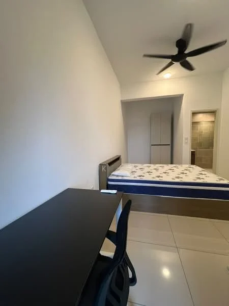 Bedroom features: queen-size bed, black wooden bed frame, white bedding with blue accent, study desk in black, black chair, ceiling fan, white painted walls, glossy tile flooring, built-in wardrobe, doorway leading to bathroom, window with natural light; style: modern.