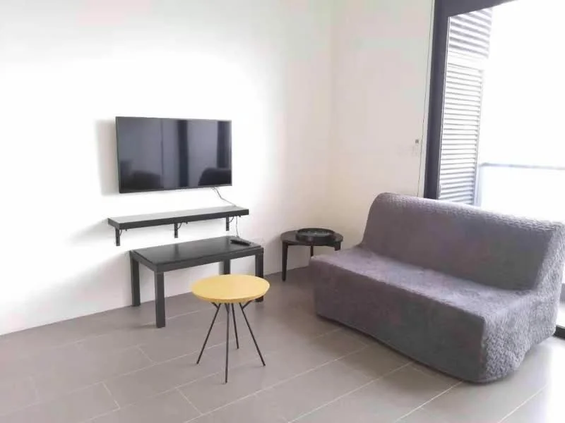 Living features: grey fabric sofa, black coffee table, small round yellow side table, wall-mounted flat-screen TV, light grey tiled flooring, white painted walls, sliding glass door, black window shutters; style: modern.