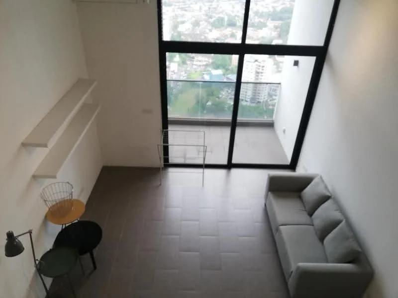 Living features: grey fabric sofa, round black side table, wooden round table, floor lamp, large floor-to-ceiling windows, city view, light grey tiled flooring, white painted walls, open shelving; style: modern; view: city.