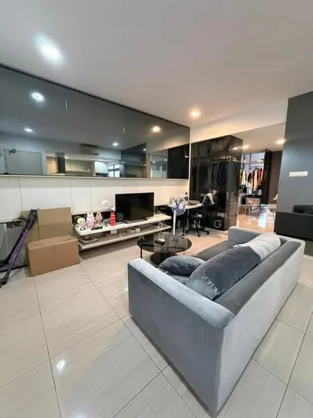 Living features: grey fabric sofa, glass coffee table, flat-screen TV, black feature wall, white tiled flooring, mirrored wall, built-in shelving, decorative items on shelves, ambient lighting, open layout, boxes for storage; style: modern.