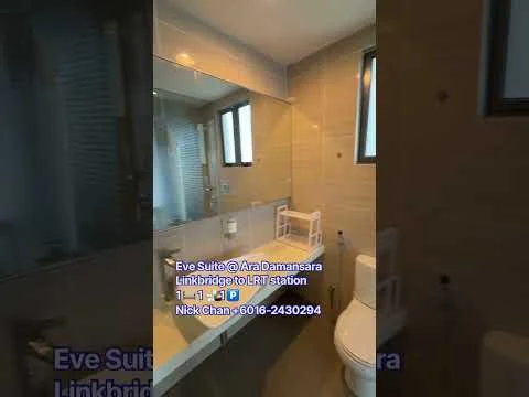 Bathroom features: white tiled walls, cream tiled flooring, single-sink vanity with mirror, chrome basin mixer faucet, one-piece toilet, window for natural light, shower area with glass partition, wall-mounted storage shelf; style: modern.