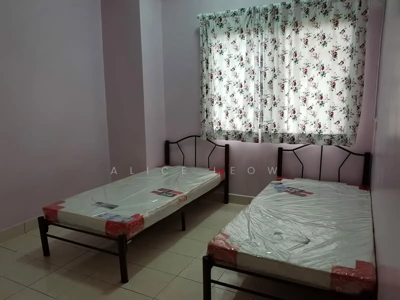 Bedroom features: two single beds with mattresses, metal bed frames, floral patterned curtains, white walls, tile flooring, window with natural light, plastic wrapping on mattresses.