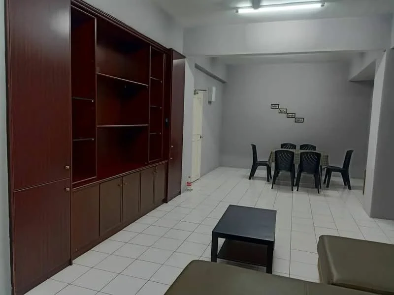 Living features: white tiled flooring, light grey painted walls, built-in wooden shelving unit, dark wood cabinetry, black coffee table, 6-seater dining table with black plastic chairs, door leading to another room, fluorescent ceiling lights; style: modern.
