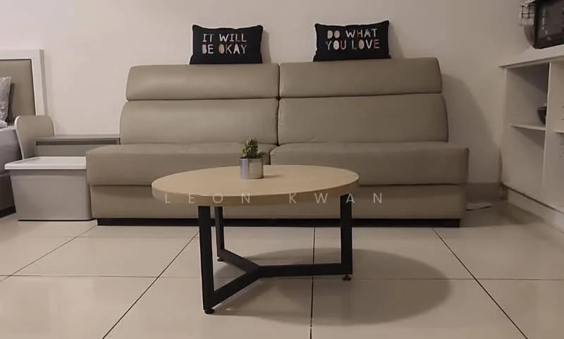 Living features: 3-seater leather sofa in beige, decorative throw pillows with text, round coffee table with wooden top and black metal legs, ceramic plant pot with small plant, glossy tile flooring, white wall, built-in shelving unit, TV console; style: modern.