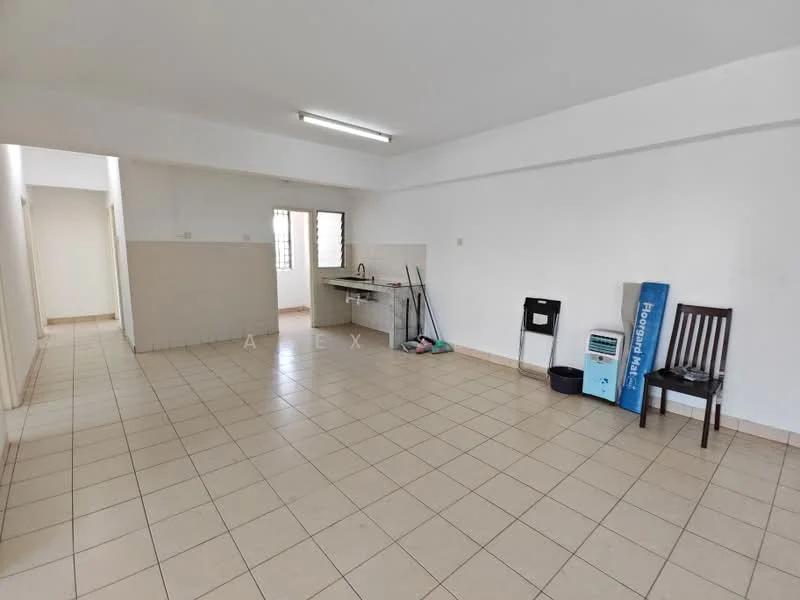 Room features: white painted walls, tile flooring, fluorescent ceiling lights, kitchen area with sink, kitchen cabinetry, empty space, cleaning supplies visible, one chair, one trash bin.