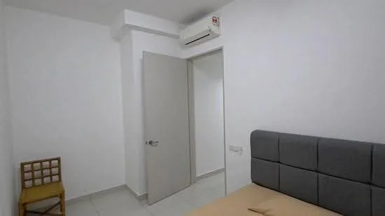 Bedroom features: white painted walls, tile flooring, grey upholstered headboard, single bed, wall-mounted split AC, door to hallway, chair, light switch.