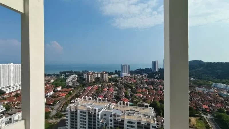 Exterior type: high-rise condominium; features: city skyline view, sea view, surrounded by residential buildings, multi-storey buildings in foreground, green hills in background, clear blue sky; style: modern.