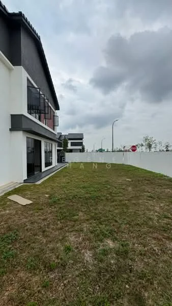Exterior type: linked terrace house; features: manicured lawn, concrete pathway, two-storey building, black painted facade, white painted facade, large windows, balconies on upper floor, surrounding greenery, road access, fenced perimeter; style: modern.