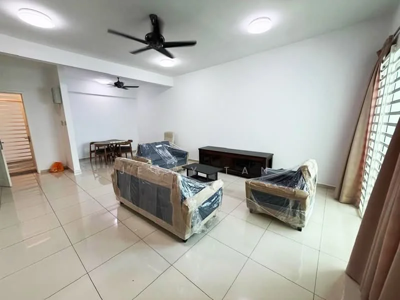 Living features: white painted walls, glossy tile flooring, 5-blade ceiling fan, recessed downlights, two 3-seater fabric sofas wrapped in plastic, wooden TV console, dining table with chairs visible in background, large windows with sheer curtains; style: modern.