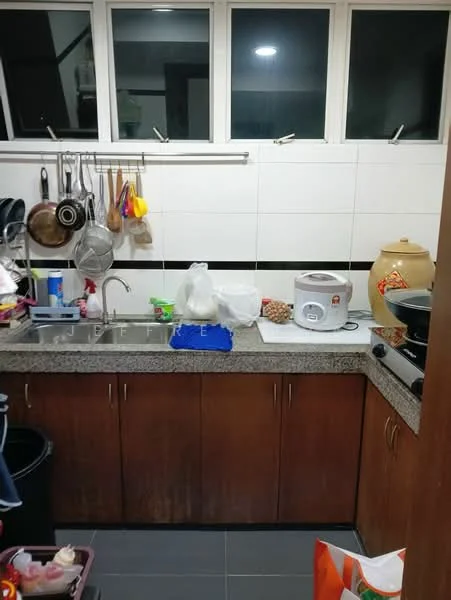 Kitchen features: double-bowl stainless-steel sink, granite countertop, wood cabinetry, white tiled walls, black accent tile, rice cooker, large ceramic jar, hanging pots and utensils, black frying pan, trash bin, floor tiles in dark grey; style: modern.