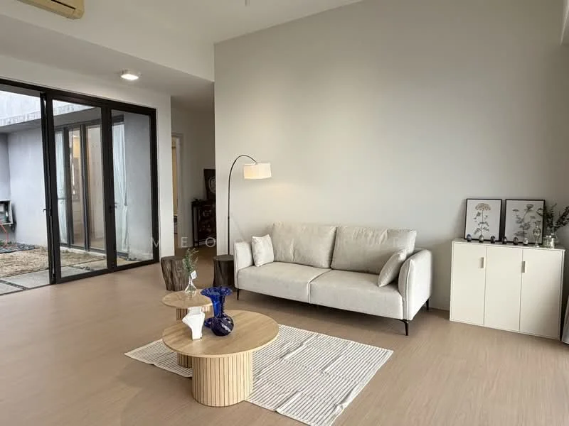 Living features: light grey painted walls, laminate flooring, 3-seater fabric sofa in light beige, floor lamp with curved arm, round coffee table with wooden base, striped area rug, decorative vase on coffee table, framed artwork on side cabinet, white side cabinet with two doors, large glass sliding doors leading to outdoor area; style: modern; view: garden.