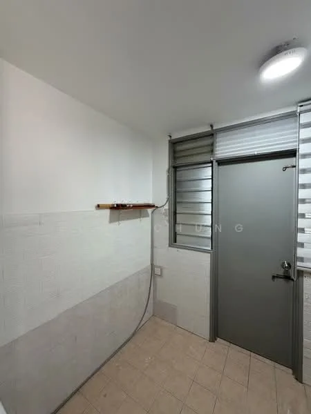 Room features: white painted walls, light beige tiled flooring, window with louvered glass, metal door, shelf mounted on wall, ceiling light fixture.