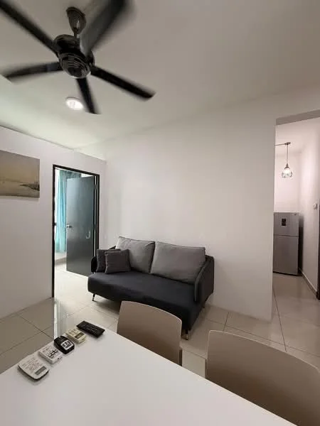 Living features: 3-seater fabric sofa in grey, white painted walls, ceiling fan, tile flooring, dining table with chairs, refrigerator in background, doorway leading to another room, decorative wall art; style: modern.