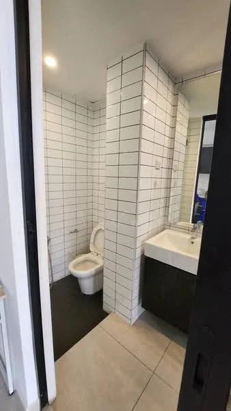 Bathroom features: white subway tile walls, black tiled flooring, single-sink vanity with dark wood cabinet, chrome basin mixer faucet, framed mirror, one-piece toilet, recessed downlights; style: modern.