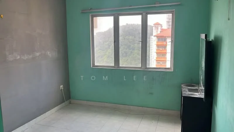 Room features: green painted walls, grey accent wall, tile flooring, large window with city view, TV console, unfurnished space; view: city.