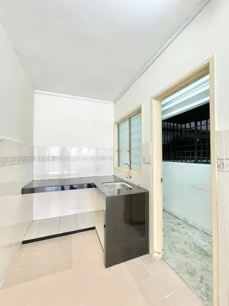 Kitchen features: black granite countertop, single-bowl stainless-steel sink, chrome pull-down faucet, white tiled backsplash, cream painted walls, tile flooring, window with security bars, built-in cabinetry; style: modern.