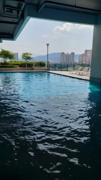 Exterior type: swimming pool deck; features: infinity pool, pool deck with loungers, landscaped greenery, city skyline view, surrounded by high-rise buildings, outdoor lighting; style: modern.