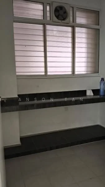 Room features: white painted walls, grey tiled flooring, window with horizontal blinds, shelf with dark surface, wall-mounted fan, no visible appliances or furniture.
