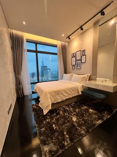 Bedroom features: king-size bed with white bedding, upholstered headboard, floor-to-ceiling windows, city skyline view, dark wood flooring, recessed downlights, decorative wall art, sheer curtains, area rug with geometric pattern, built-in mirror, wall-mounted bedside lamps; style: modern; view: city.