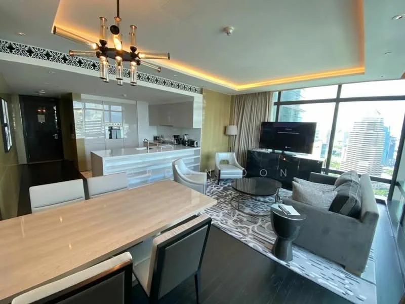 Living features: floor-to-ceiling windows, city skyline view, grey fabric sofa, coffee table, area rug with geometric pattern, wall-mounted TV, dining table with 6 chairs, pendant light fixture, recessed LED downlights, dark wood flooring, decorative wall paneling, curtains, open kitchen with bar seating; style: modern; view: city.