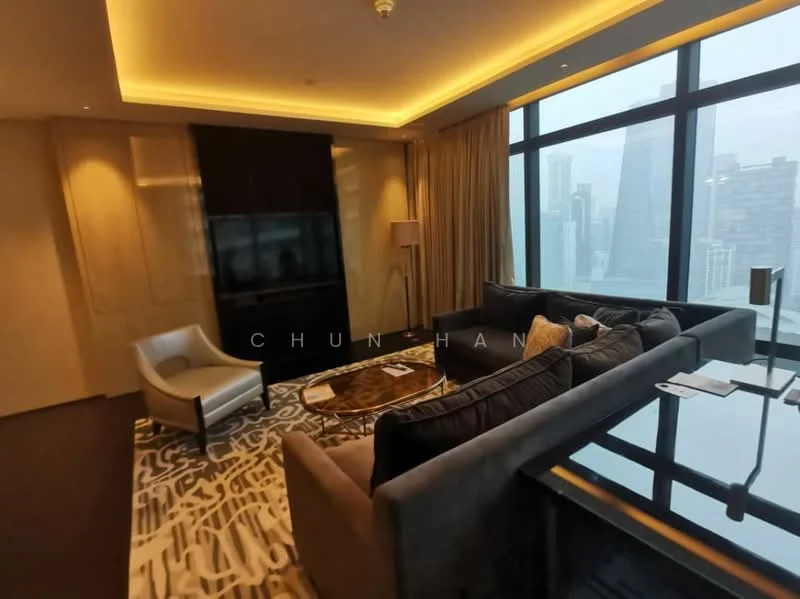 Living features: grey fabric sectional sofa, white accent chair, glass coffee table, area rug with abstract pattern, wall-mounted TV, floor-to-ceiling windows, curtains, recessed LED downlights, decorative wall paneling, dark wood flooring; style: modern; view: city.