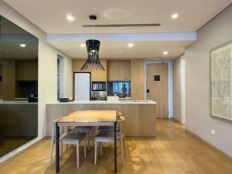 Kitchen features: wood cabinetry, white countertop, stainless-steel sink, chrome pull-down faucet, built-in oven, freestanding refrigerator, 4-burner gas hob, pendant light, dining table with 4 chairs, wood flooring, mirror wall, open layout; style: modern.