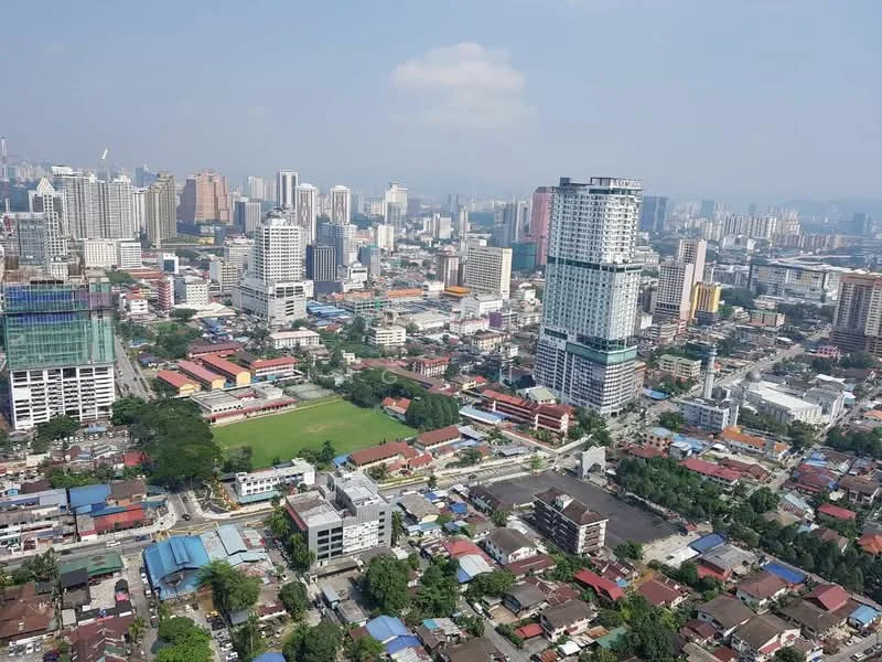 Exterior type: high-rise condominium; features: city skyline view, mixed-use development, green spaces, high-rise buildings, low-rise residential areas, commercial buildings, open fields, urban landscape; style: modern.