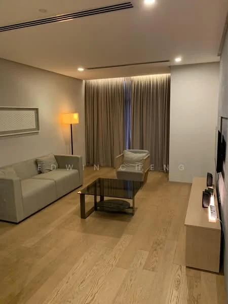 Living features: light grey fabric sofa, coffee table with glass top, wooden flooring, floor-to-ceiling curtains, wall-mounted TV, TV console, recessed lighting, decorative wall panel; style: modern.