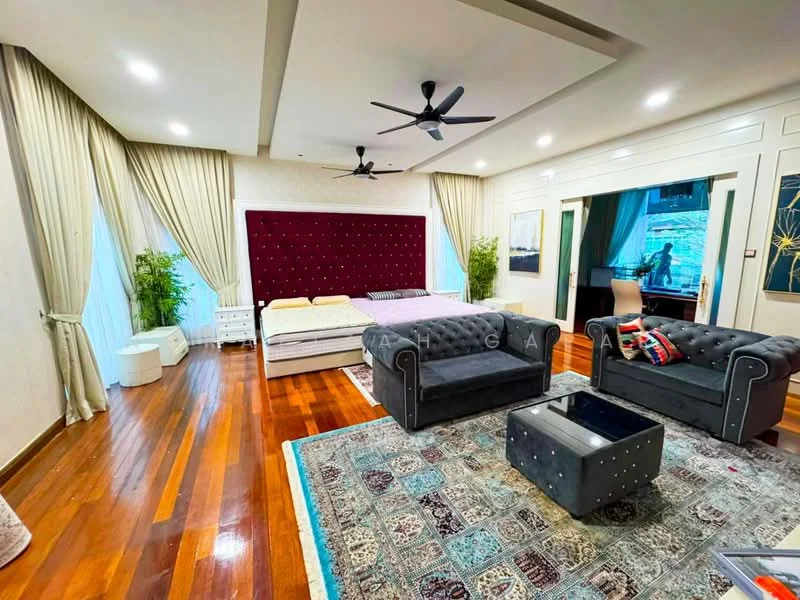Bedroom features: wooden flooring, cream painted walls, tray ceiling, 5-blade ceiling fan with light, upholstered headboard in burgundy, queen-size bed, 2 bedside tables, black fabric sofa, coffee table, area rug with geometric pattern, decorative wall art, large window with sheer curtains; style: modern; view: garden.