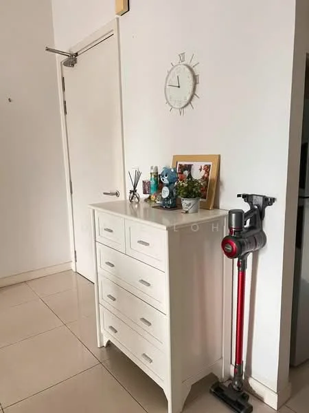 Room features: white painted walls, cream tiled flooring, white chest of drawers with five drawers, wall clock, decorative plants, framed photo, vacuum cleaner, decorative figurines; style: modern.