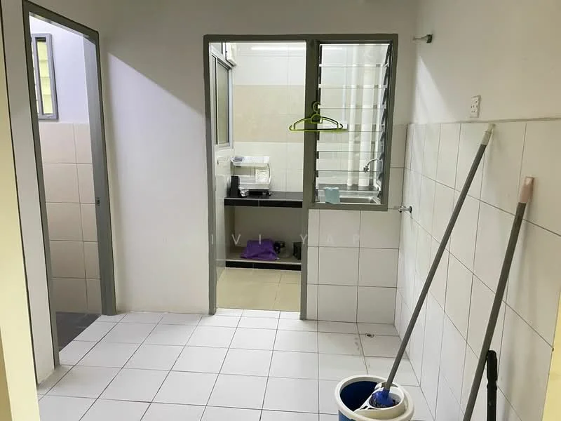 Laundry features: white tiled flooring, white painted walls, grey framed windows, sink with countertop, hanging rod for clothes, cleaning supplies visible, door leading to bathroom, door leading to another room.