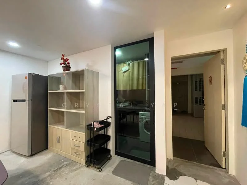 Room features: stainless-steel fridge, wooden shelving unit, cabinet with drawers, black sliding glass door, washing machine, concrete flooring, recessed downlights, decorative plant on shelf, open layout, neutral wall color; style: modern.