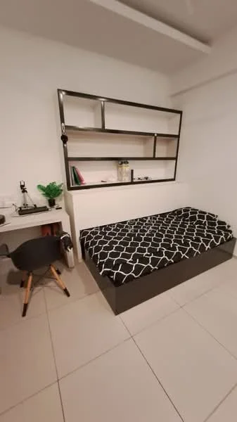 Bedroom features: queen-size bed with black and white patterned bedding, built-in shelving unit above bed, white painted walls, light-colored tile flooring, study desk with black chair, decorative plant on desk, minimalist decor; style: modern.