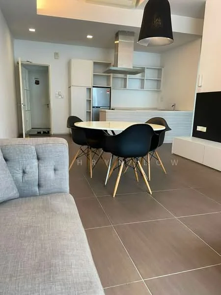 Living features: grey fabric sofa with tufted back, round dining table, 4 black dining chairs with wooden legs, white cabinetry, stainless-steel fridge, stainless-steel range hood, kitchen countertop, grey tiled flooring, recessed ceiling lights, pendant light fixture; style: modern. Kitchen features: white cabinets, stainless-steel fridge, stainless-steel range hood, kitchen countertop, grey tiled backsplash; style: modern.