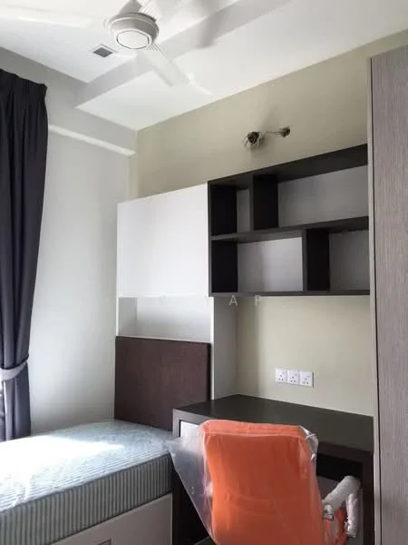 Bedroom features: single bed with mattress, grey upholstered headboard, built-in wardrobe with white and brown cabinetry, study desk with orange chair, shelves above desk, white painted walls, ceiling fan, curtains in dark grey, light fixture on ceiling, wooden flooring; style: modern.